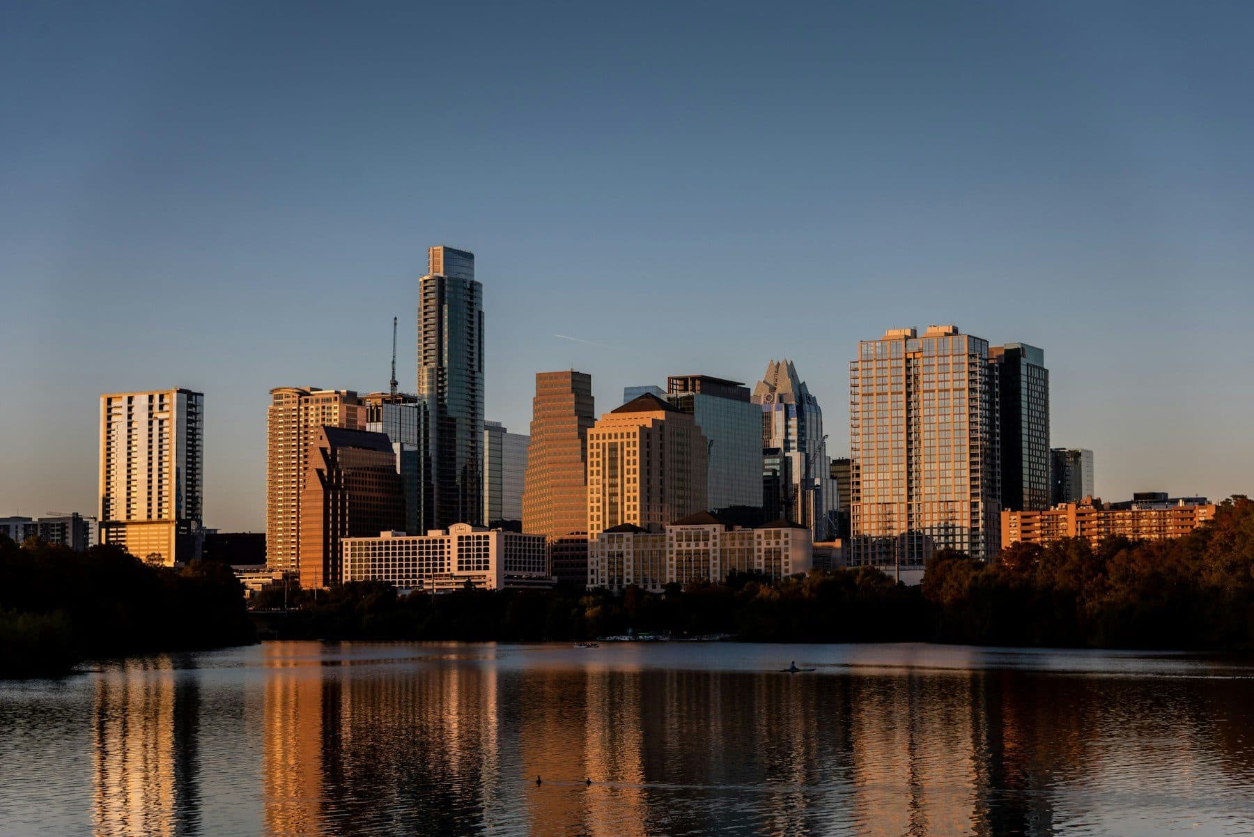 Austin skyline across Lady Bird Lake at sunset